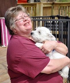 Sam sharing puppy kisses with Barbara